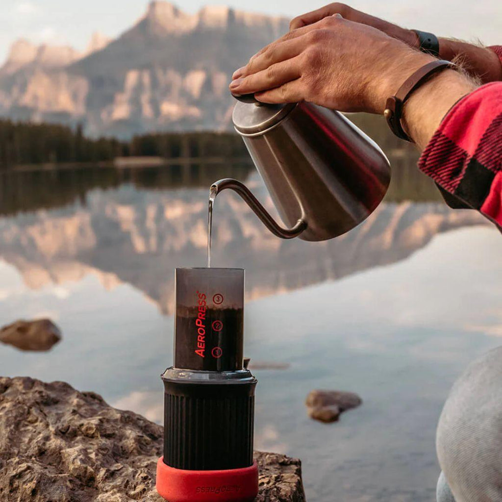 Aeropress go portable coffee maker, used during camping outside brewing coffee