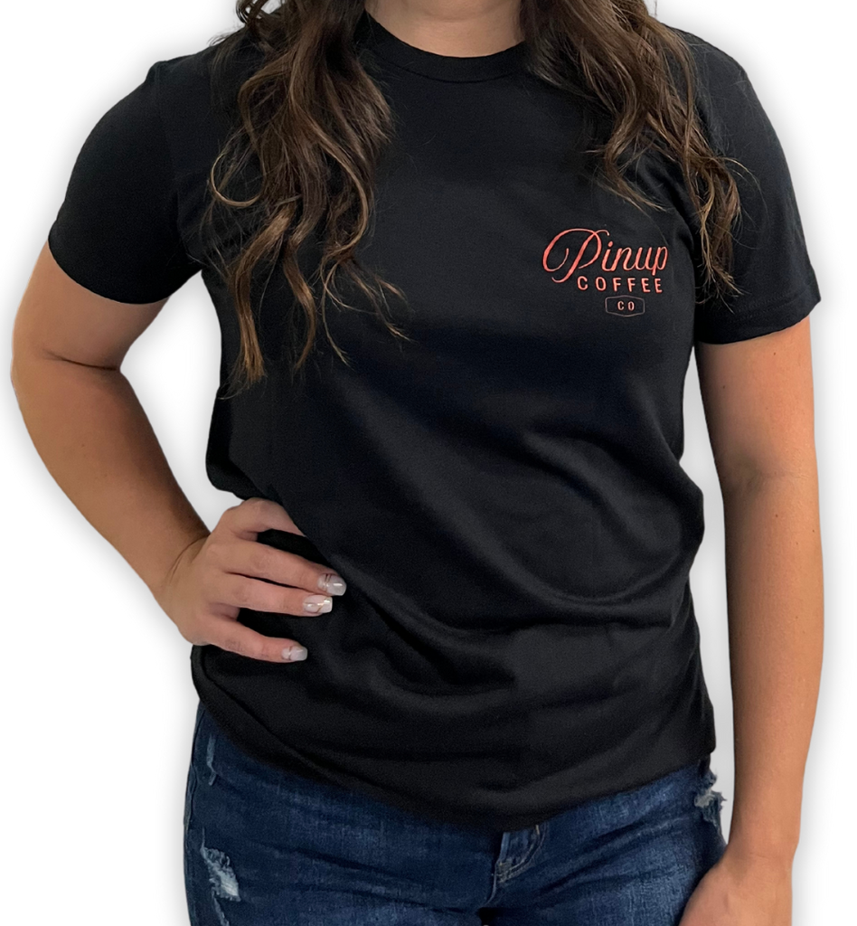 Front view of a women's black t-shirt with the Pinup Coffee Co logo